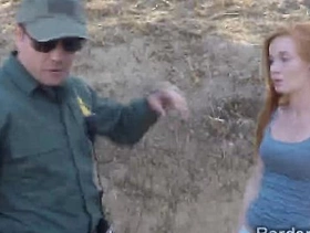 Officer welcomes a redhead immigrant