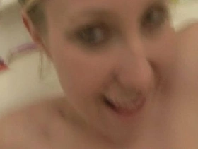 Blonde girl taking a hot bath