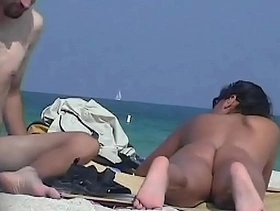 Beach nudist asses sexily waved under the blue sky