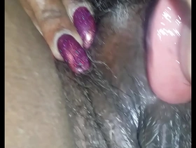 Eating her black hairy pussy
