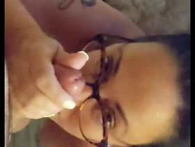 Nerdy milf in glasses sucks cock and gets a facial