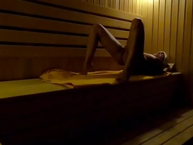 Hidden camera girl masturbates in sauna in a sports club at night